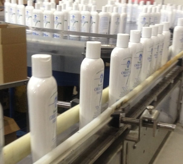 Bottles of Dorothy’s Original Skin Oil moving along the filling line at the manufacturing facility